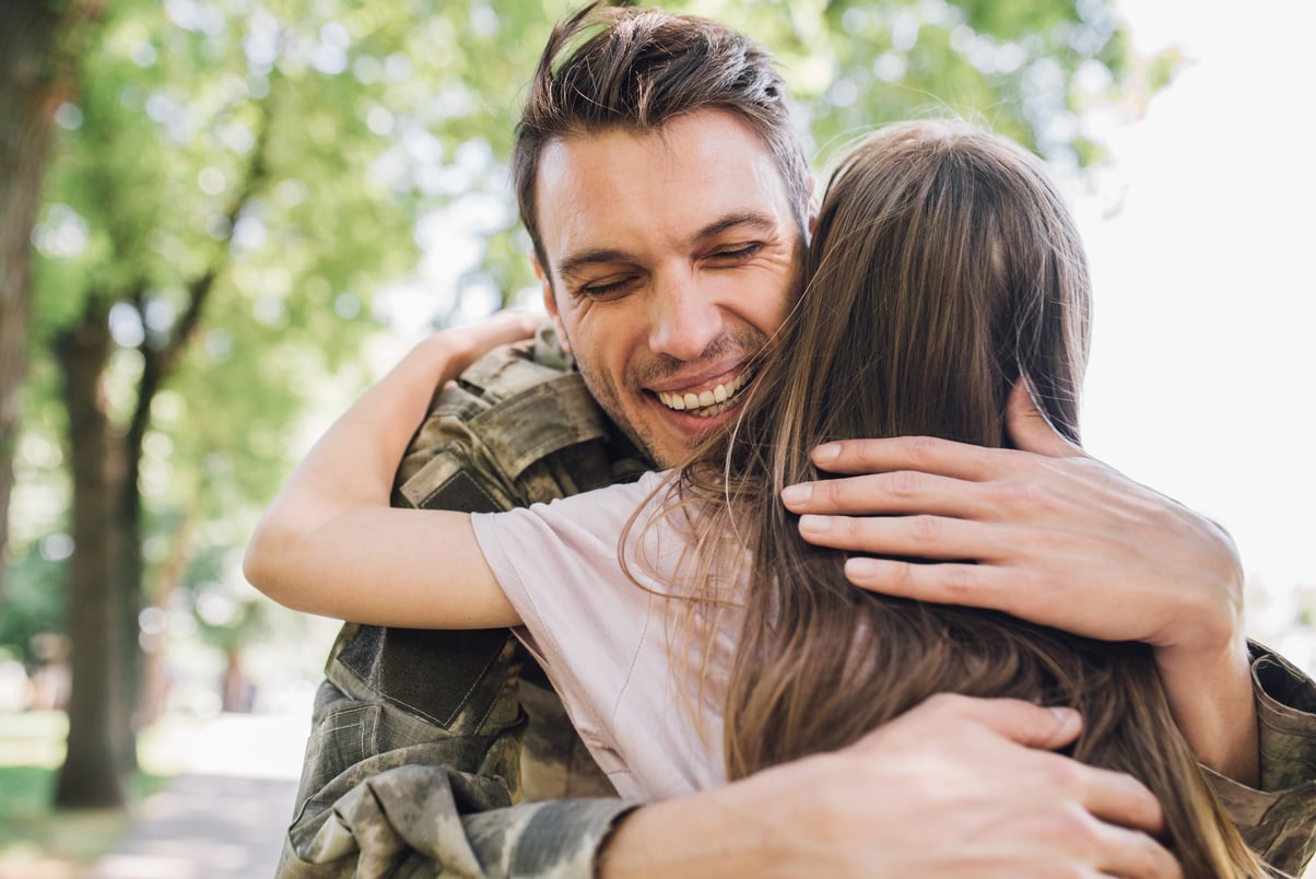 War veteran hugging daughter