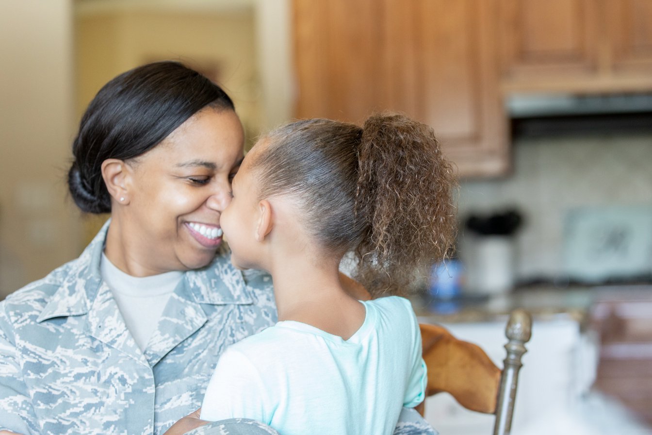 Veteran Mother and daughter being affectionate